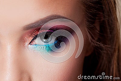 Bright eye makeup. Pink and blue color, colored eyeshadow. Stock Photo