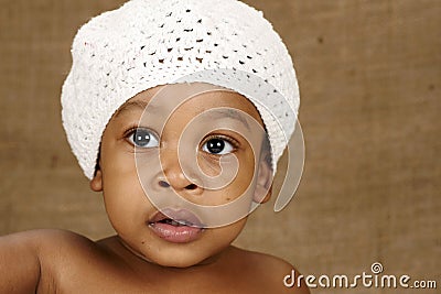 Bright eyed toddler with hat Stock Photo