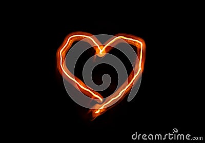 Bright flame burn heart symbol on black background in the dark, Valentine`s day or romantic concept background, copy Stock Photo