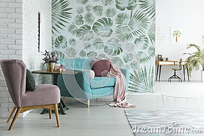 Monstera wallpaper in living room Stock Photo