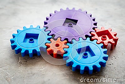 Bright gears for great technology of team work and correct mechanism on stone background Stock Photo