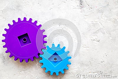 Bright gears for great technology of team work and correct mechanism on stone background top view copyspace Stock Photo