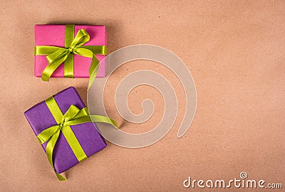 Bright gift boxes on a brown paper background. Copy space Stock Photo