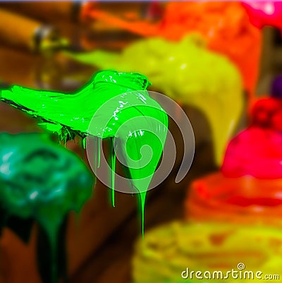 bright green color of ink for print tee shirt is dripping Stock Photo