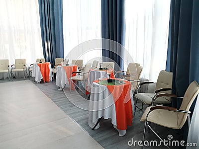 bright hall with tables around the perimeter Stock Photo