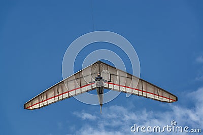 Bright hang glider wing silhouette from below Stock Photo