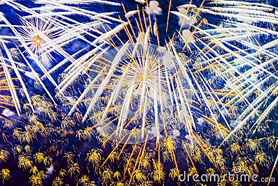 Bright Holiday Fireworks with sparks, comets, colored smoke and vivid nebula on blue sky similar to painting of impressionists. Stock Photo