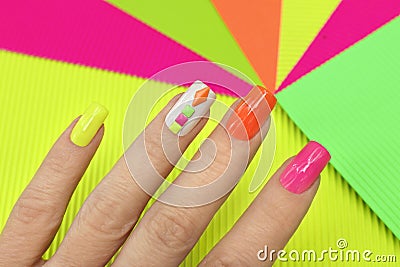 Bright illuminated multicolored manicure. Stock Photo