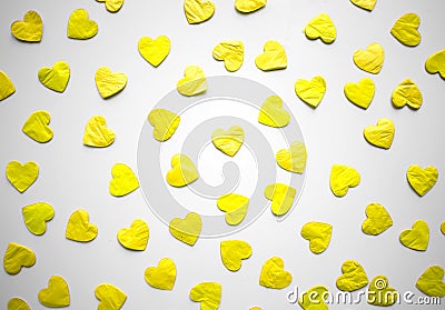 Bright illuminating hearts confetti on ultimate gray background Stock Photo