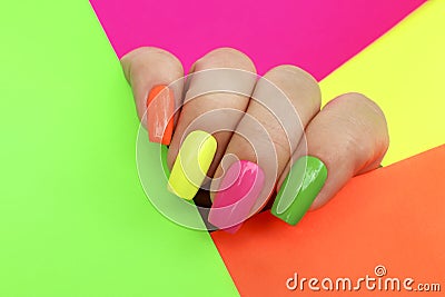 Bright illuminating multicolored fashionable manicure. Stock Photo