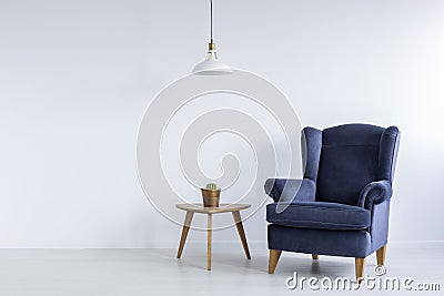 Bright interior with blue armchair Stock Photo