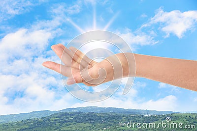 Bright light in hand, closeup. Solar energy concept Stock Photo