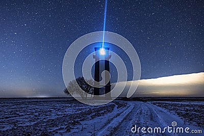 Bright lighthouse beaconing at the end of the milky way. Beautiful lighthouse Stock Photo