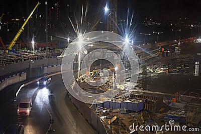 Bright lights over urban constrruction site att night Editorial Stock Photo