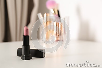 Bright lipstick on dressing table Stock Photo