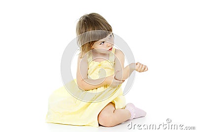 Bright little girl is sitting Stock Photo