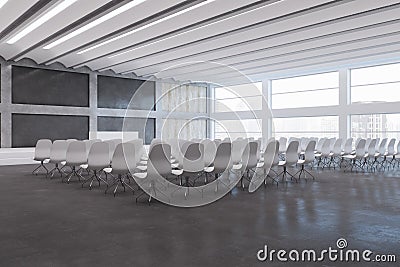 Bright loft style concrete and wooden auditorium with window and city view, stage and many chairs. Stock Photo