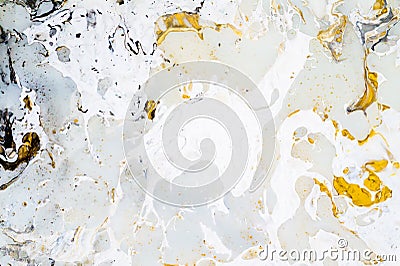 Bright marble background texture with gold, black, grey and white colors, using acrylic pouring medium art technique. Useful as a Stock Photo