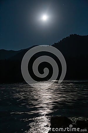 Bright moon over the mountain river Katun in Altai, Russia Stock Photo
