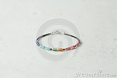 Bright multicolored bracelet. Ruby, coral, carnelian, citrine, emerald, apatite, amazonite, turquoise, lapis lazuli, tanzanite, Stock Photo