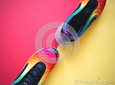 Bright multicolored sneakers on a yellow background. flat lay Stock Photo