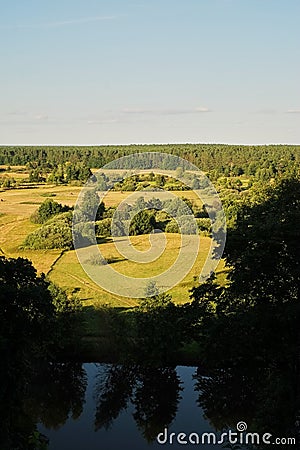 A bright natural landscape in the fall season. A view over the forest and meadows of Ukraine Stock Photo