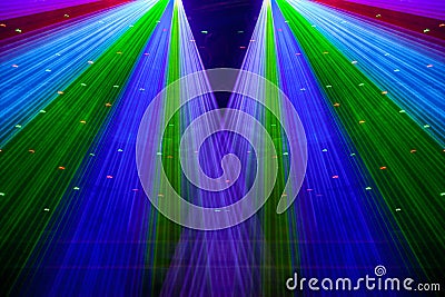 Bright nightclub red, green, purple, white, pink, blue laser lights cutting through smoke machine smoke making light patterns Stock Photo