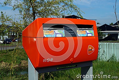 Bright orange Dutch PostNL mailbox Editorial Stock Photo