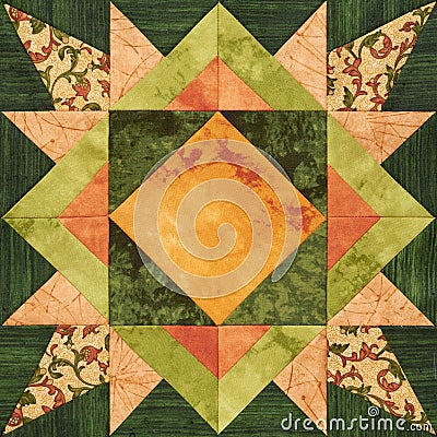 Bright orange-green geometric patchwork block from pieces of fabrics Stock Photo