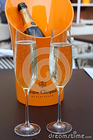 Bright orange ice bucket holding bottle of Veuve Clicquot champagne Blue Hen Beer and Wine Garden, Saratoga Springs, New York,2018 Editorial Stock Photo