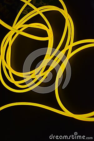 Bright orange luminous wire, twisted light wire, cable. Stock Photo