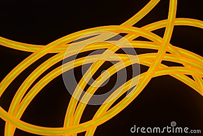 Bright orange luminous wire, twisted light wire, cable. Stock Photo