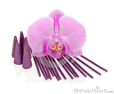 Bright orchid, aromatic sticks and the cones Stock Photo