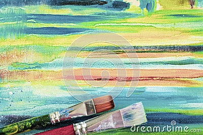 Bright painted canvas of artist and dirty artistic brushes, texture of mixed artistic oil paints, different colors, mix spots, Stock Photo