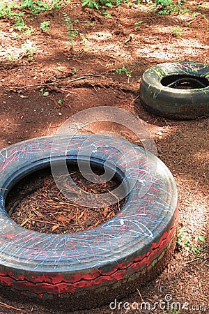 Bright painted tires on playground Stock Photo