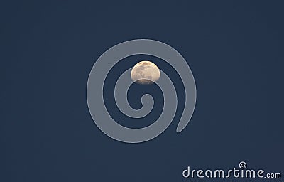 Bright partial moon in the sky Stock Photo