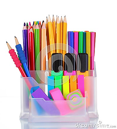 Bright pens, pencils and markers in holder Stock Photo