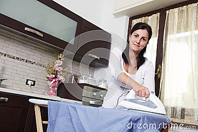 Bright picture of lovely housewife with iron Stock Photo