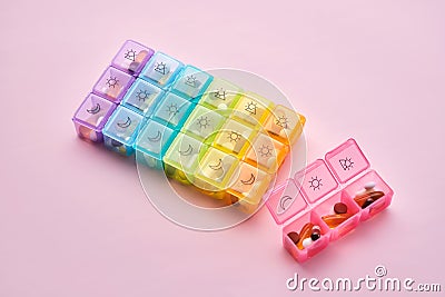 Bright pill box with different pills and vitamins. Stock Photo