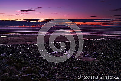 Bright purple pink sunset sky over Walney Island, Barrow-in-Furness, England Stock Photo
