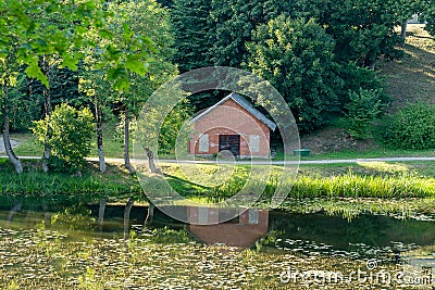 A bright red barn reflected in a pond Stock Photo