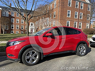 Bright Red Car Parked in a Quiet Neighborhood Editorial Stock Photo
