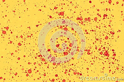 Bright red random round paint splashes on yellow background. Abstract colorful texture Stock Photo