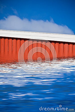 Bright Red Siding House in water flood Stock Photo