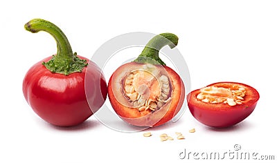 Bright ripe round red chili peppers cuts and seeds Stock Photo