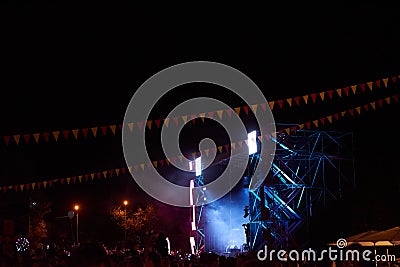 Bright scene at night, flags, lots of people, concert, festival Editorial Stock Photo