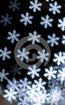 Bright snowflakes vertical bokeh background. Stock Photo