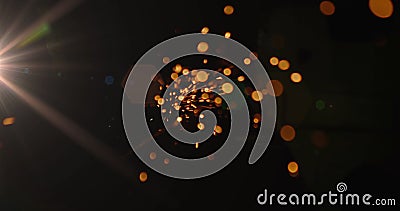 Bright sparks flying in dark space creating dynamic abstract visual effect Stock Photo