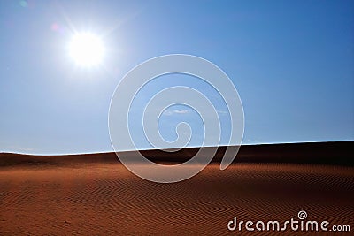 Bright sun, clear blue sky and rippled desert sand. Arabian Desert, Riyadh, Saudi Arabia Stock Photo