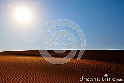 Bright sun, clear blue sky and rippled desert sand. Arabian Desert, Riyadh, Saudi Arabia Stock Photo